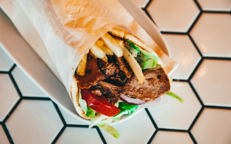 Shawarma wrap recipe with juicy chicken, garlic sauce, and fresh vegetables